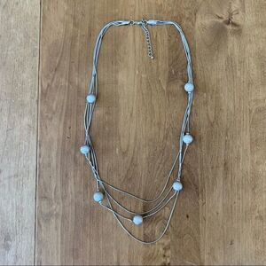 Silver colored necklace with silver beads